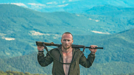 Hunter with his rifle. Hunter in camouflage clothes ready to hunt with hunting rifle. Hunting period...