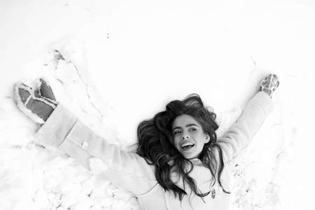 Beautiful young woman laughing outdoors. Women in winter clothes. Beauty Winter Girl in frosty winter Park. Winter emotion.の写真素材