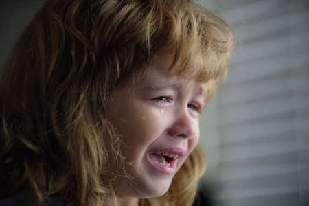 Crying Little Boy. Sad Child at Home.