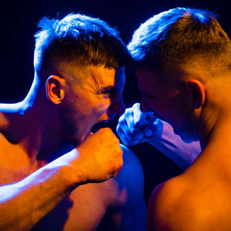 Two men fighting. Conflict and bullying man.の写真素材
