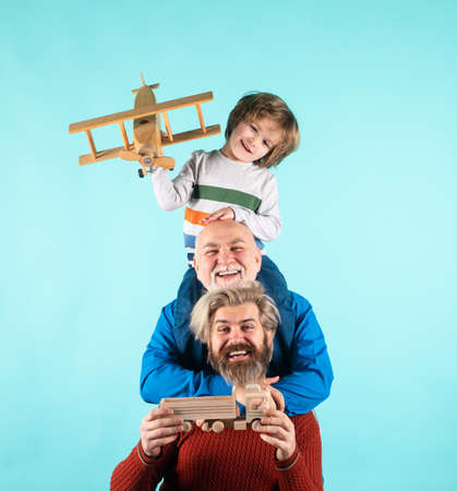 Man family. Father grandfather and son isolated on blue. Kid boy with toy airplane. Men family...