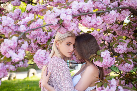 Spring girls face. Outdoor portrait of a beautiful sensual woman. Attractive sexy girls in a field with flowers.の写真素材