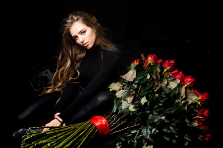Valentines day flower present. Sexy girl with big rose bouquet. Rich woman.の写真素材