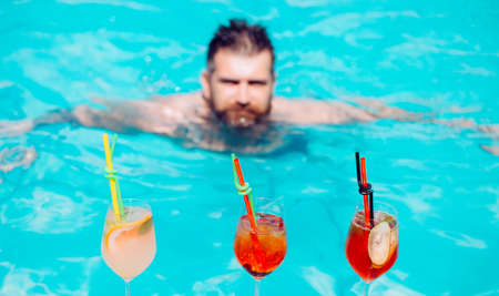 Cocktail at the pool. Summer holiday. Relaxing on the beach with cocktail.の写真素材