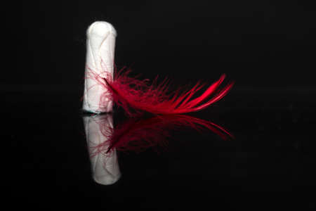 Cotton tampon. Menstruation cycle. Periods and ovulation. Menses, menarche, menorrhoea.の写真素材