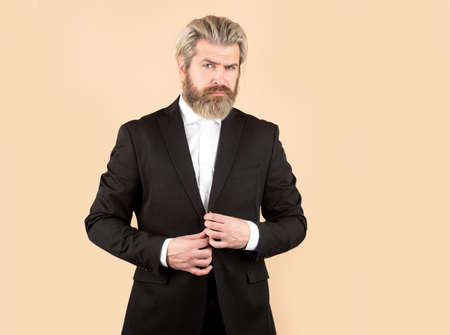 Man in black suit. Luxury business fashion. Classic suits vogue. Male in classic suit. Businessman concept.の写真素材