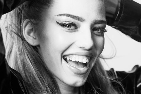 Woman attractive on happy face touches temples. Fashion beauty concept.の写真素材