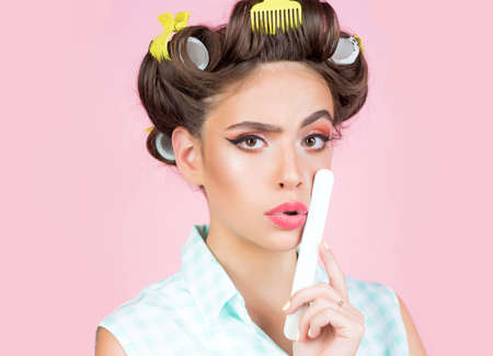 Beauty salon. Vintage housewife woman make manicure. Fashion and beauty. Young and beautiful.の写真素材