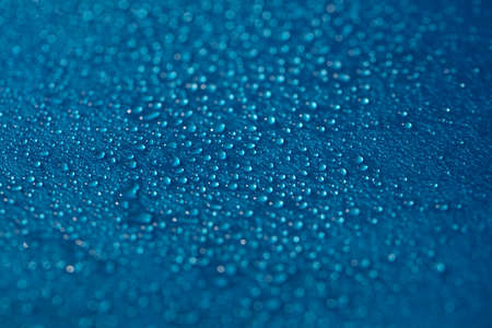 Drops blue texture. Wet water on glass background. Bubble pattern.