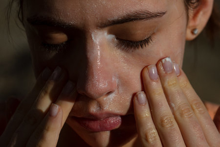 Skincare. Woman washing face with cleancing gel. Acne protection.の写真素材