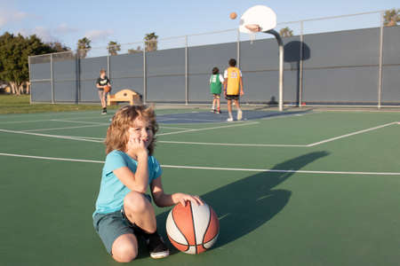 Kids playing basketball. Child boy sport activity.の写真素材