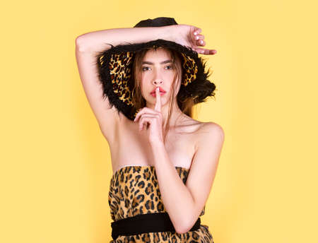 Fashion woman in leopard clothes. Trendy girl with animal print dress.の写真素材