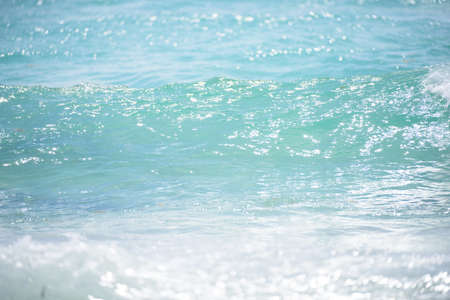 Sea background. Closeup of sea waves. Ocean water surface with ripples low waves on seascape...