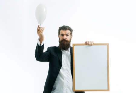 Young handsome bearded man scientist or professor holding teacher board isolated on white background. Idea copy space concept.の写真素材