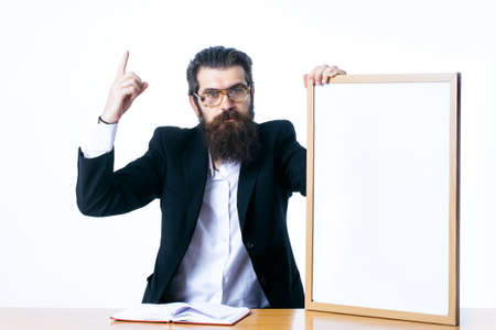 Idea copy space concept. Handsome professor scientist holding teacher board isolated on white...