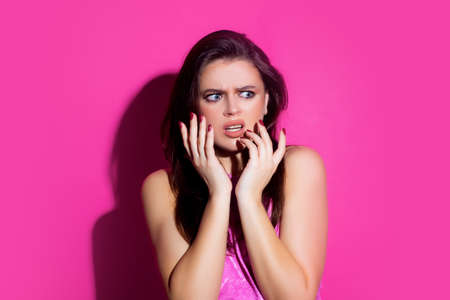 Scared girl portrait. Fear emotions. Afraid woman. Isolated.の写真素材