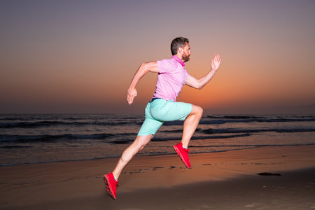 Active healthy runner jogging outdoor. Dynamic movement. Sport and healthy lifestyle. Fit man...