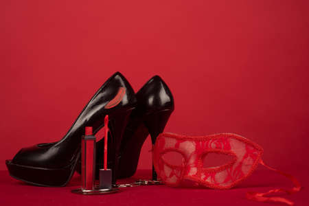 Female fashion and beauty. Adult sex games. Red Lipstick. Black high heels. Elegant concept. Makeup cosmetics. Red Lipstick. Black high heels. Elegant concept.の写真素材