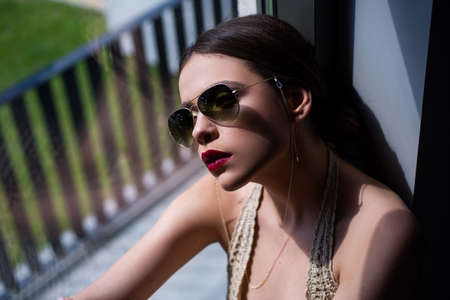 Sunglasses vogue fashion. Sensual model girl with makeup. Young woman fashion glasses style.の写真素材