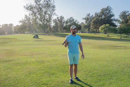 Man golfer playing golf on a golf course.の写真素材