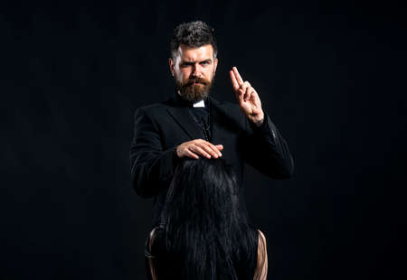 Portrait of priest with pray. Monk man oblation. Senior religion holy male with a confident expressionの写真素材