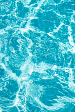 Abstract ripple wave and clear turquoise water surface in swimming pool, blue water wave for...
