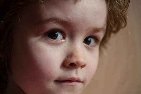 Kids portrait, close up head of cute child with big eyes.の写真素材