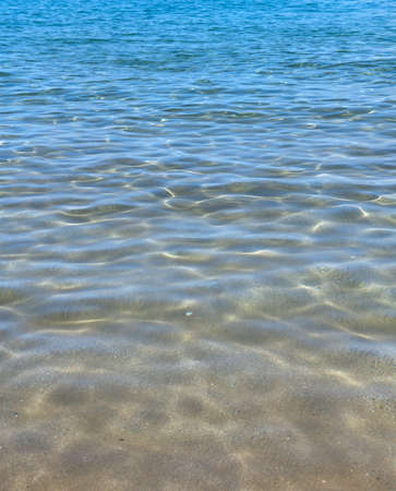 Sea abstract or rippled water texture background. Calm water surface texture with splashes and...