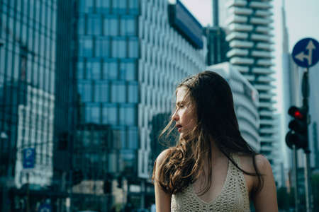 Trendy street fashion portrait. Woman in modern town. Fashion street style. City vogue. Fashionable girl walking on streets.の写真素材
