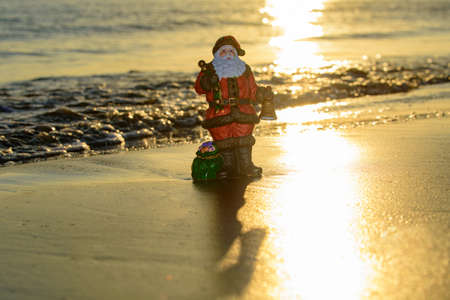Christmas holiday concept. Santa on the sunset sea. Summer New Year.の写真素材