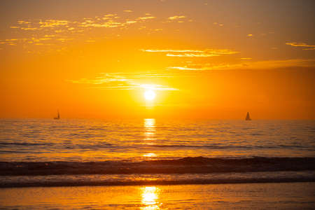 Seascape golden sunrise over the sea. Nature landscape. Beautiful orange and yellow color on ocean...