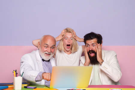 Surprised business people working as a team at the office. Shocked group of business people....