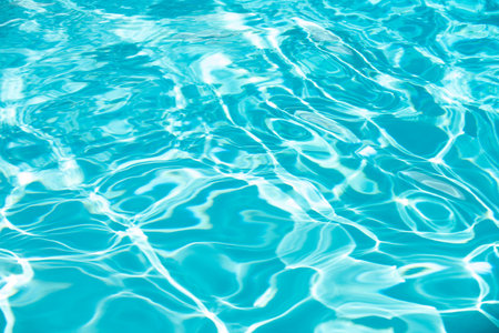 Water in swimming pool, background with high resolution. Wave abstract or rippled water texture.