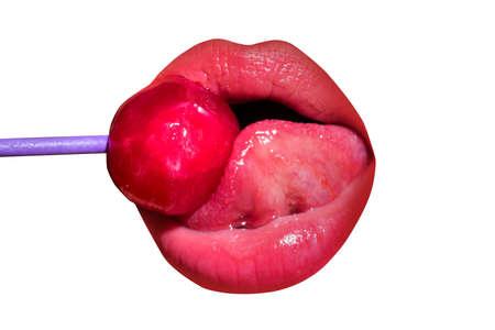 Close up lips with lollipop isolated, sexy blowjob, sensual mouth with lipstick eats sweets. Sexy design for women and girls. Beautiful lips isolated on white.の写真素材