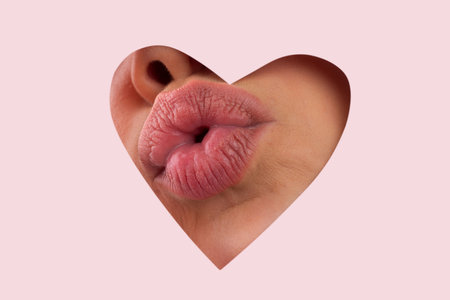 Valentine heart kiss on the lips. Beauty lips with heart shape copy space. Valentines Day. Beautiful...