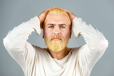 Bearded blonde man with long beard and moustache. Portrait of bearded man with color hair. Hair coloring.の写真素材