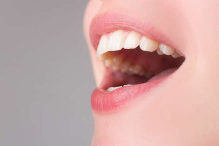 Dental Care. Beautiful young woman smile. Dental health background.
