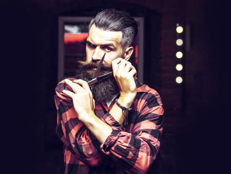 bearded man with scissors