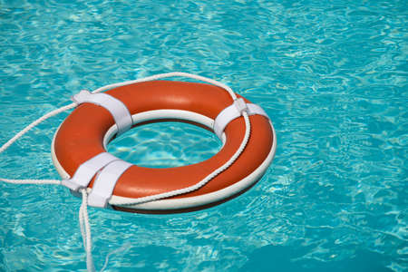 Safety equipment, Life buoy or rescue buoy floating on sea to rescue. Help in water concept.