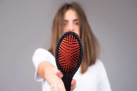 Woman worried about hair loss. Hair fall problem.の写真素材