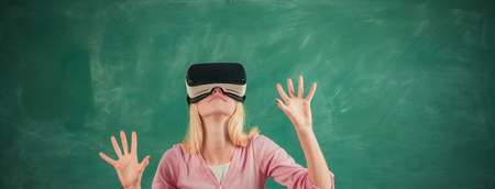 Student with VR glasses on a blackboard. Education in high school university college with future...