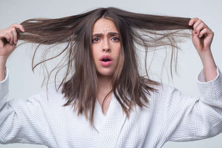 Hair for hair loss problem, woman show her hair tangled damaged hair.の写真素材