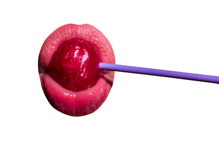Licking candy. Lollipop model. Woman lips sucking a candy. Glamor sexy model with red lips eat sweats lolly pop isolated on white.の写真素材