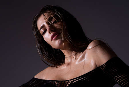 Beautiful sensual woman fashion model. Sexy female posing in studio.の写真素材