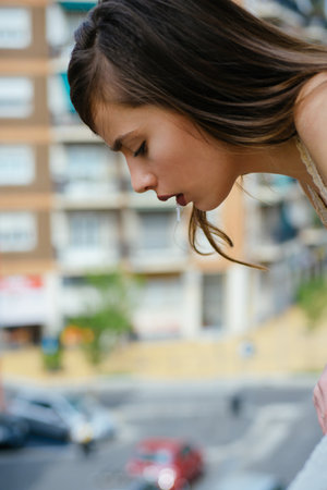 Bully lady Woman spit. Bad feeling or female puke outdoor.の写真素材