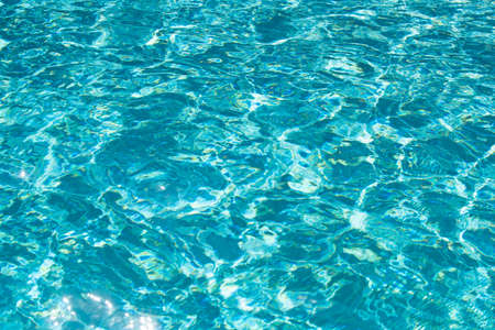 Tansparent clear calm water surface texture. Abstract nature background. Sea water pattern.の写真素材