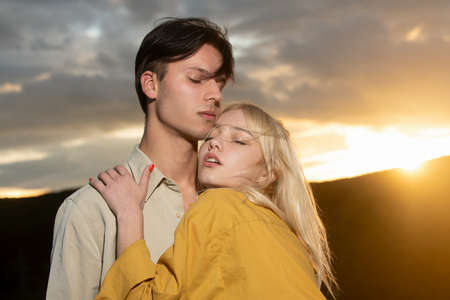 Tenderness couple touch. Young couple in love hug each other. Love story.の写真素材