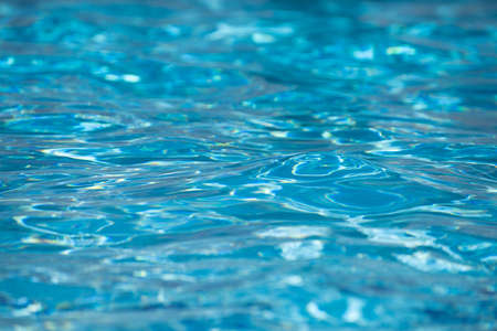 Abstract ripple wave and clear turquoise water surface in swimming pool, blue water wave for background and abstract design.の写真素材