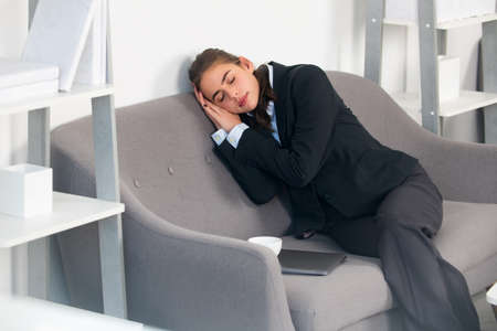Bored businesswoman sleep workplace feeling no motivation or lack of sleep tired of boring office...