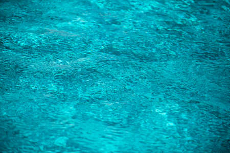 Abstract ripple wave and clear turquoise water surface in swimming pool, blue water wave for...